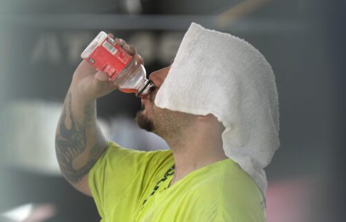 A construction worker hydrates at the Shedd Aquarium Tuesday